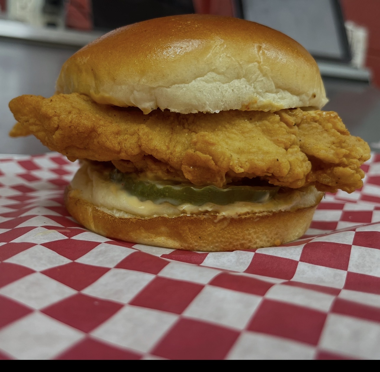 Crispy fried chicken sandwich on a brioche bun